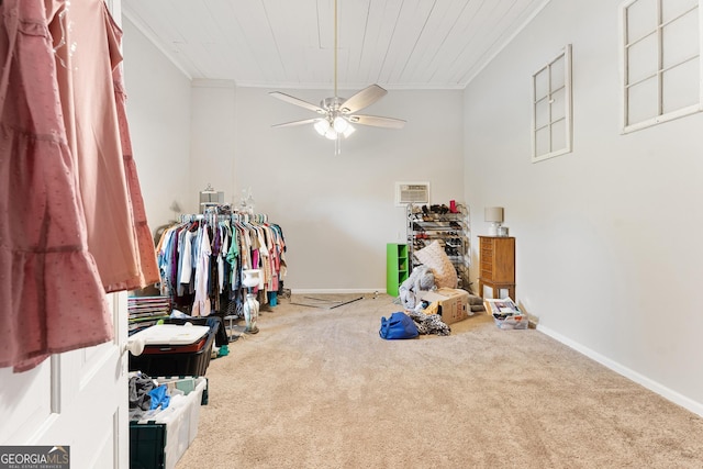 recreation room with carpet flooring, ornamental molding, and ceiling fan