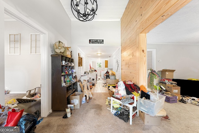 interior space with wood walls and crown molding