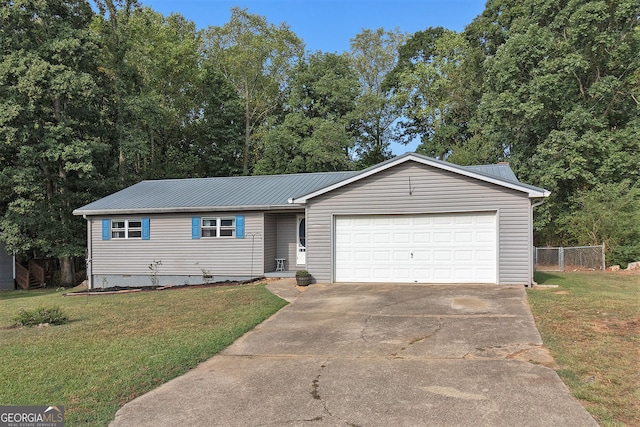 ranch-style home with a front lawn and a garage