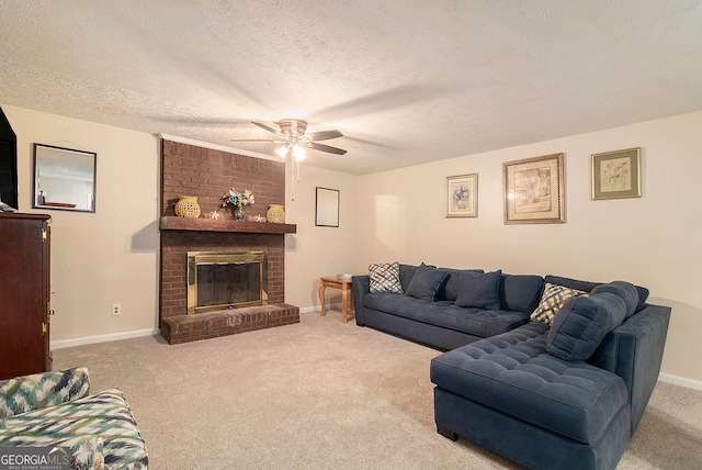 carpeted living room featuring ceiling fan, a textured ceiling, and a fireplace