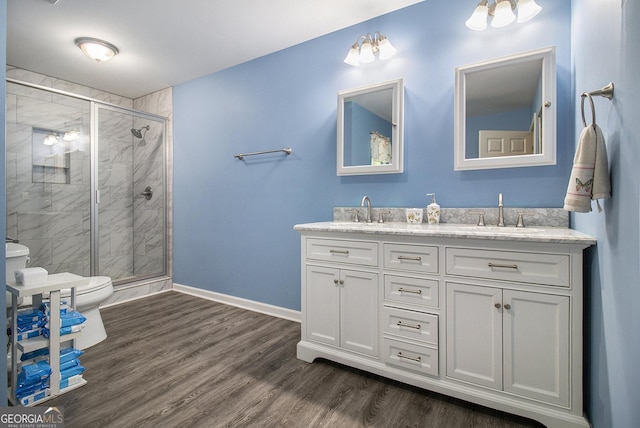 315 Watts Rd, Hiram, GA 30141 - bathroom with double vanity, toilet, baseboards, and a sink