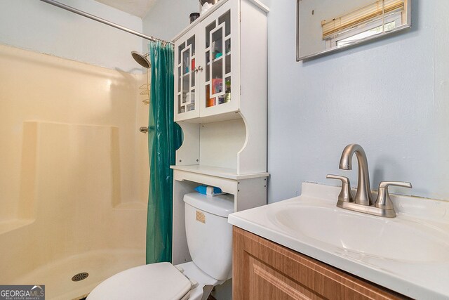 315 Watts Rd, Hiram, GA 30141 - bathroom featuring vanity, toilet, and a shower stall