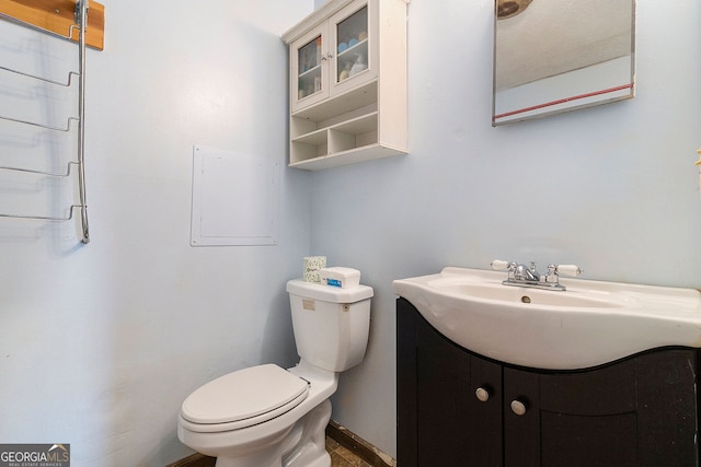 bathroom featuring vanity and toilet