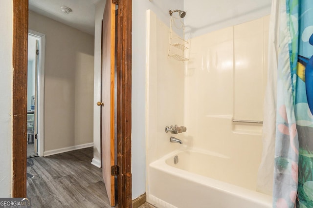315 Watts Rd, Hiram, GA 30141 - bathroom featuring baseboards, wood finished floors, and shower / bath combo with shower curtain