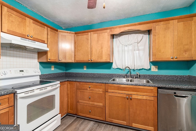 kitchen featuring white range with electric cooktop, dark wood-type flooring, sink, dishwasher, and a textured ceiling