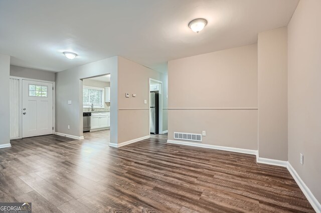 unfurnished room featuring wood-type flooring