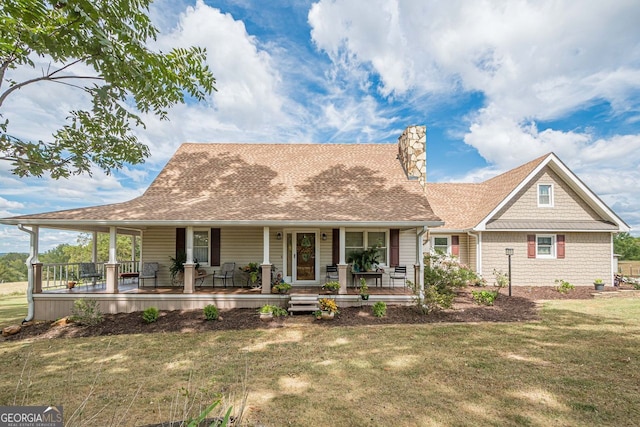 view of front facade featuring covered porch and a front yard