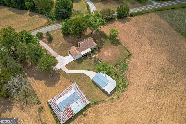 view of side of property with a garage and a lawn