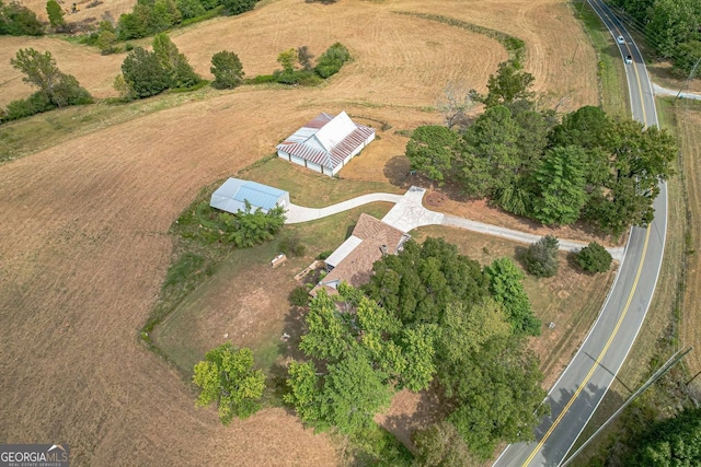 birds eye view of property with a rural view and a mountain view