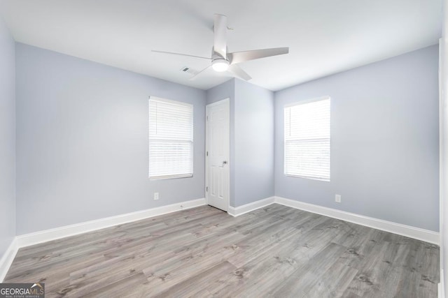 unfurnished room with light hardwood / wood-style floors and ceiling fan