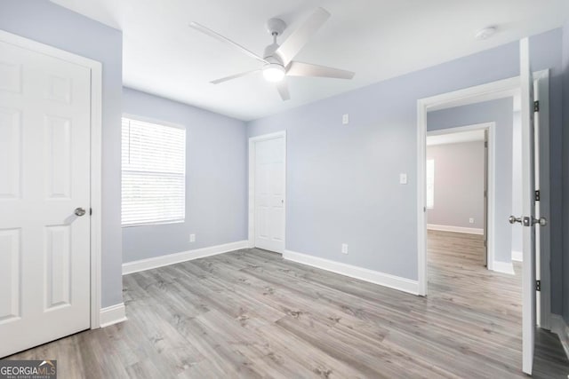 unfurnished bedroom with light hardwood / wood-style flooring and ceiling fan