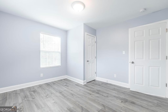 unfurnished bedroom featuring light hardwood / wood-style floors