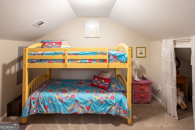 bedroom featuring vaulted ceiling and carpet floors