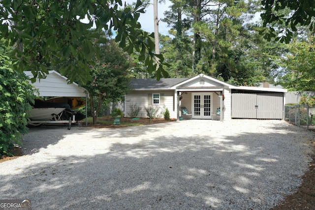 view of front facade featuring french doors and a carport