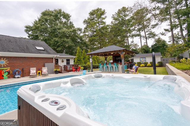 view of pool featuring a gazebo and a patio