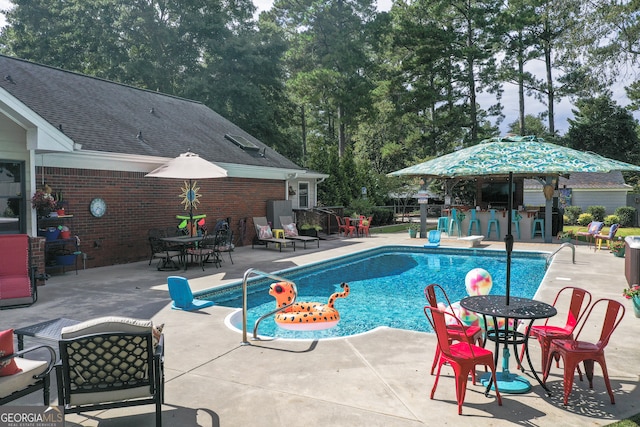 view of pool featuring a patio area