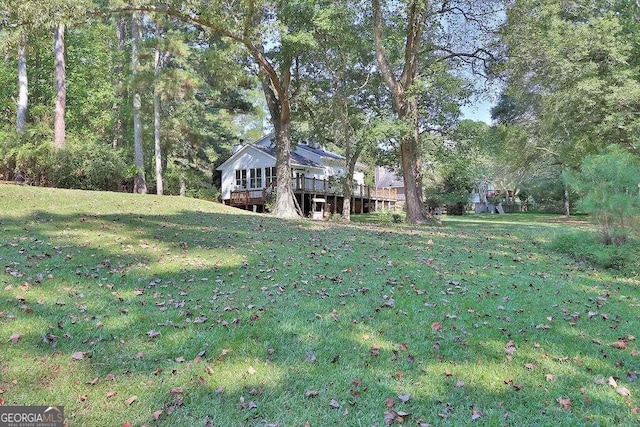 view of yard featuring a deck