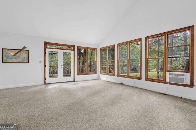 unfurnished sunroom with french doors, cooling unit, lofted ceiling, and a wealth of natural light