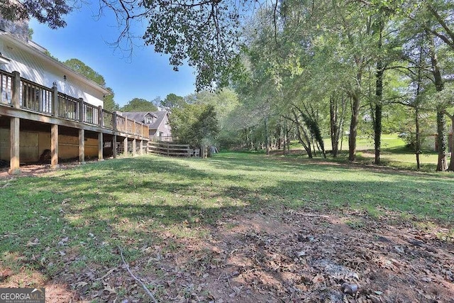 view of yard with a wooden deck