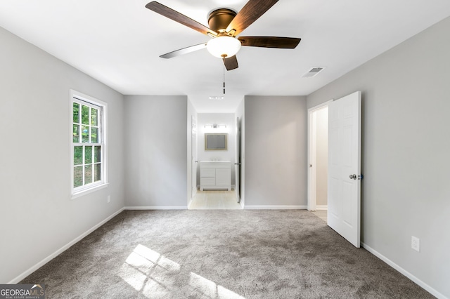 carpeted empty room with ceiling fan