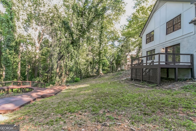 view of yard with a wooden deck