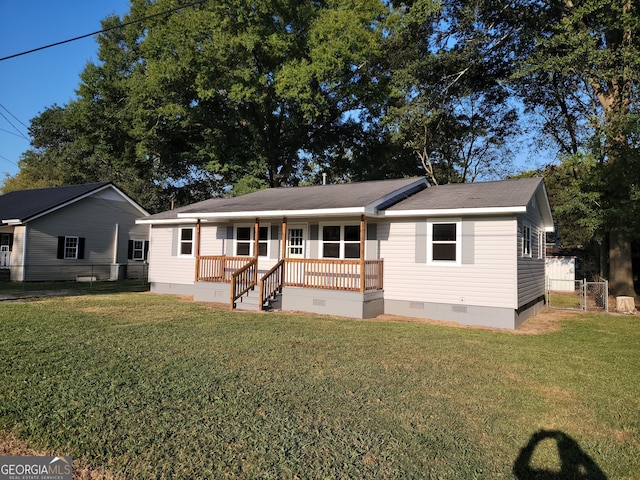 rear view of property with a yard