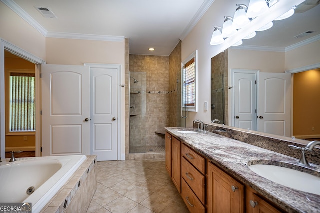 bathroom with ornamental molding, tile patterned flooring, independent shower and bath, and vanity