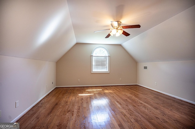 additional living space with vaulted ceiling, ceiling fan, and hardwood / wood-style flooring