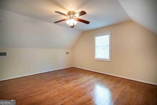 bonus room with lofted ceiling, ceiling fan, and hardwood / wood-style flooring