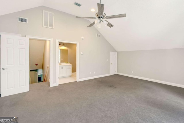 additional living space with lofted ceiling, visible vents, carpet flooring, ceiling fan, and baseboards