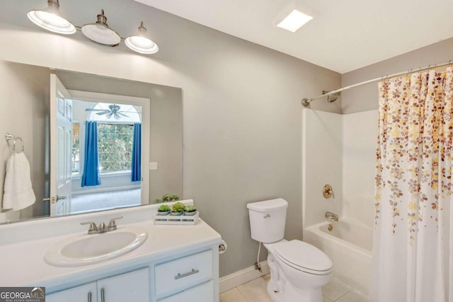 bathroom with toilet, shower / bath combo, vanity, baseboards, and tile patterned floors