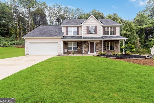 view of front of house with a porch, a garage, and a front yard