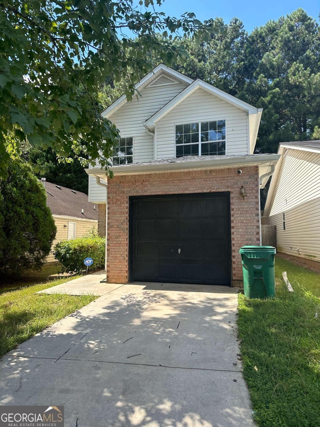 front facade with a garage