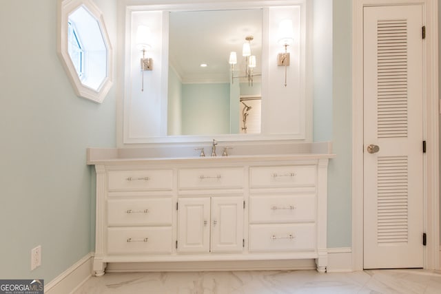 bathroom featuring vanity and ornamental molding