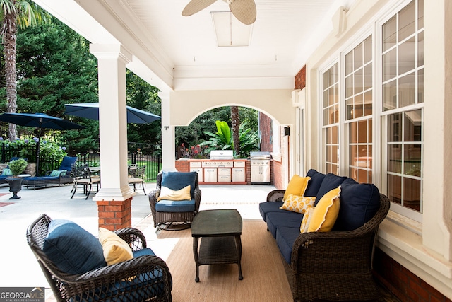 view of patio / terrace featuring area for grilling, ceiling fan, and outdoor lounge area