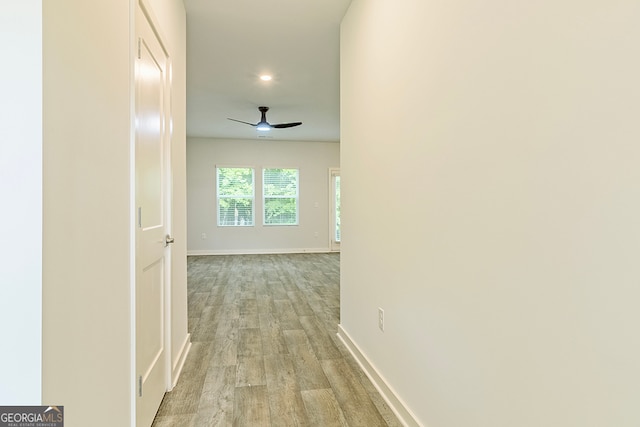 hall with light hardwood / wood-style floors