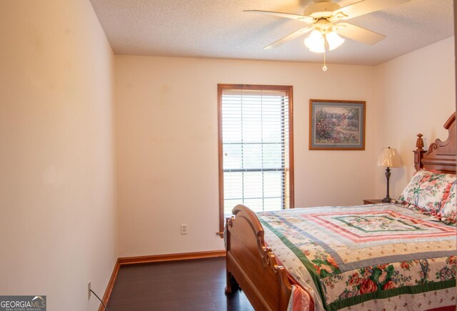 bedroom featuring a textured ceiling and a closet