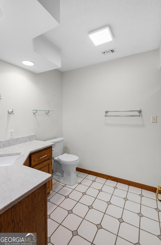 4909 Perry Rd, Claxton, GA 30417 - bathroom featuring tile patterned floors and vanity