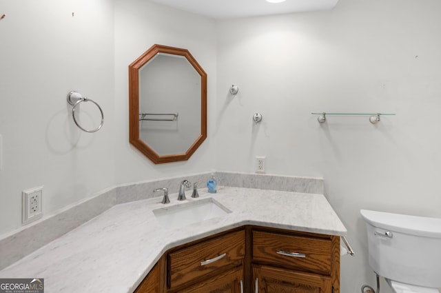 4909 Perry Rd, Claxton, GA 30417 - half bathroom featuring vanity and toilet