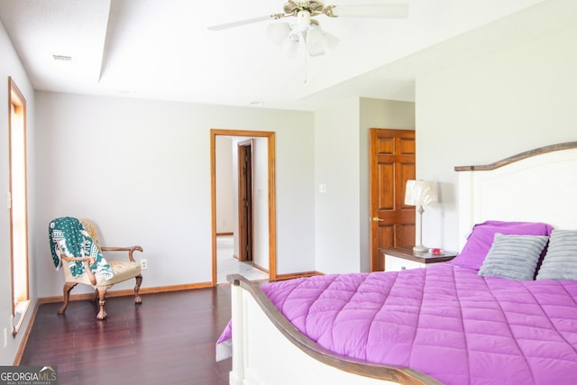 bedroom featuring dark wood-type flooring and ceiling fan