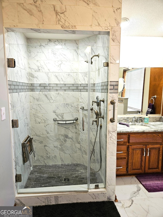 bathroom with vanity and walk in shower