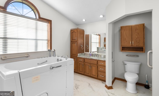 4909 Perry Rd, Claxton, GA 30417 - bathroom featuring marble finish flooring, vanity, a garden tub, and recessed lighting