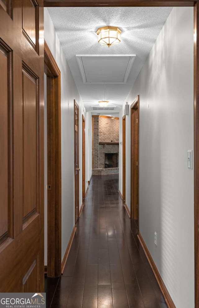 4909 Perry Rd, Claxton, GA 30417 - hall with a textured ceiling and baseboards