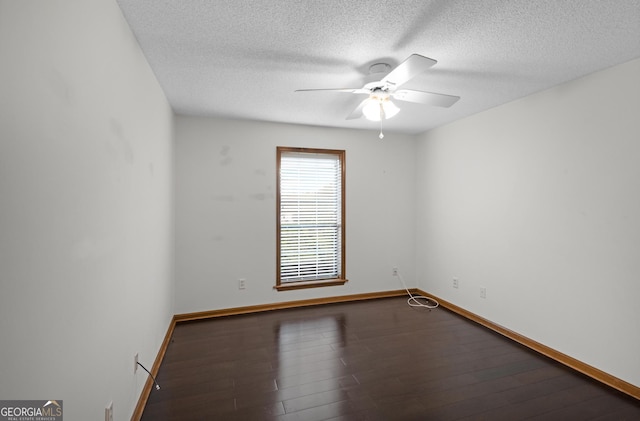 4909 Perry Rd, Claxton, GA 30417 - spare room with ceiling fan, a textured ceiling, and wood finished floors