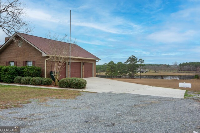 garage featuring a yard