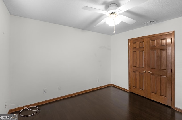4909 Perry Rd, Claxton, GA 30417 - unfurnished bedroom with wood finished floors and ceiling fan