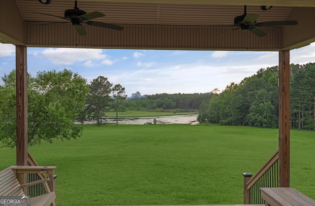 4909 Perry Rd, Claxton, GA 30417 - view of grassy yard featuring ceiling fan and a water view