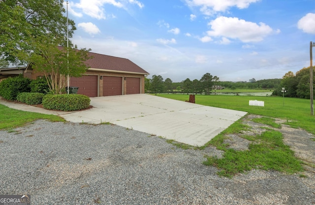 4909 Perry Rd, Claxton, GA 30417 - garage featuring concrete driveway