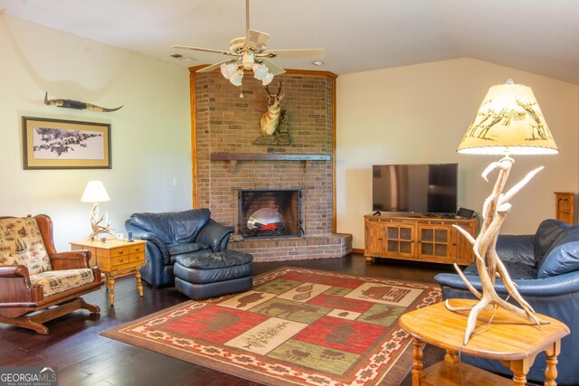 living room with lofted ceiling, ceiling fan, and hardwood / wood-style floors