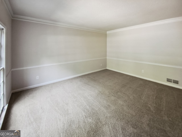 carpeted empty room with ornamental molding and a wealth of natural light